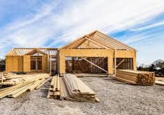 House under construction with wooden framework.
